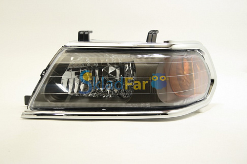 Фара левая MITSUBISHI PAJERO SPORT 04-06 хром    